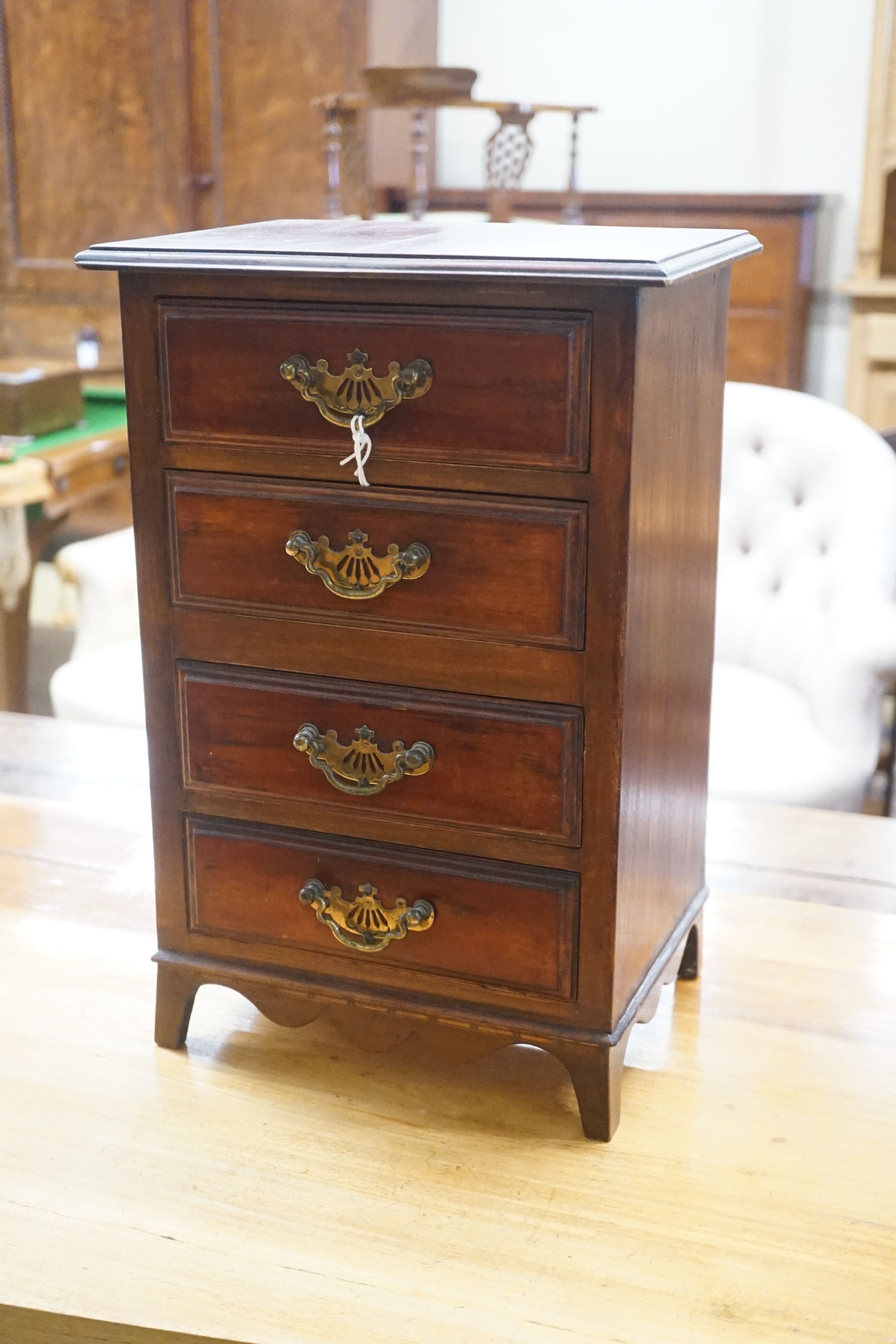 A late Victorian mahogany miniature four drawer chest, width 28cm depth 28cm height 42cm